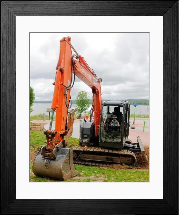 Framed Print : A young girl (2 yrs old) sitting a JCB (excavator) cabin pretending to operate it Framed Print : A young girl (2 yrs old) sitting a JCB (excavator) cabin pretending to operate it