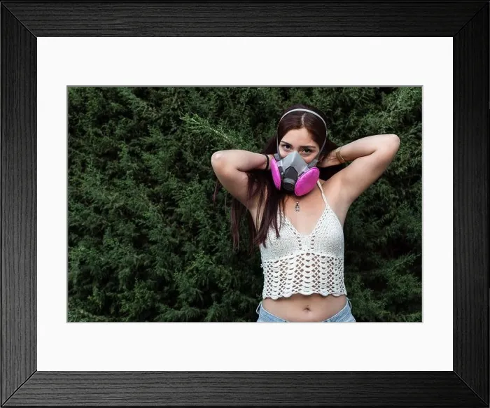 Framed Print : Hispanic female wearing full face respirator gas mask and latex gloves outdoors Framed Print : Hispanic female wearing full face respirator gas mask and latex gloves outdoors