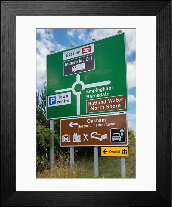 Framed Print : Large new green roundabout road primary route direction sign and brown tourist information sign, Oakham, Rutland, England, UK Framed Print : Large new green roundabout road primary route direction sign and brown tourist information sign, Oakham, Rutland, England, UK