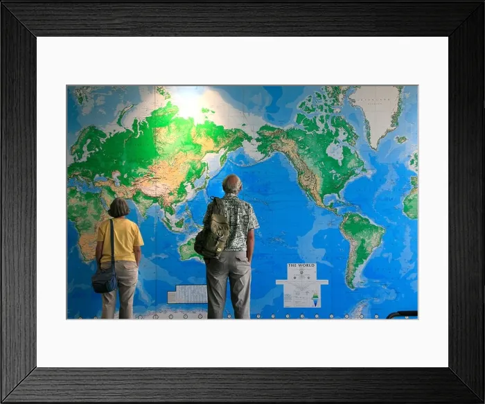 Framed Print : Travelers look at huge wall map of the World in Auckland airport New Zealand Framed Print : Travelers look at huge wall map of the World in Auckland airport New Zealand