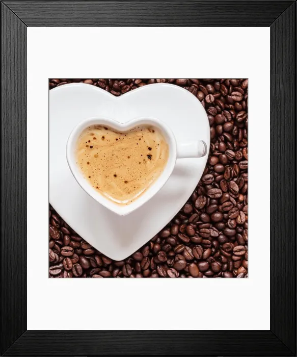 Framed Print : Hot beverage. White coffee cup heart shaped with cappucino latte on roasted beans background Framed Print : Hot beverage. White coffee cup heart shaped with cappucino latte on roasted beans background