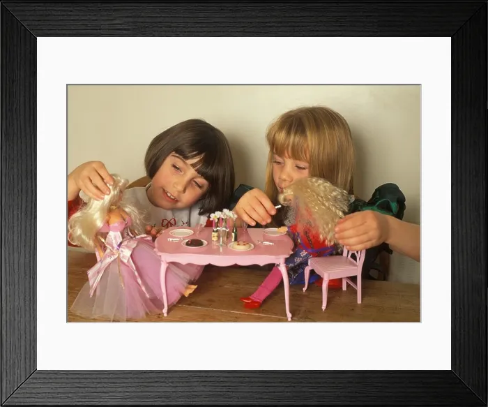 Framed Print : little girls playing with their barbie dolls Framed Print : little girls playing with their barbie dolls