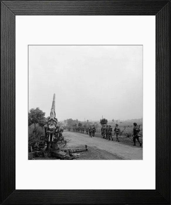 Framed Print : The British Army in North-west Europe 1944-45 Infantry of 50th (Northumbrian) Division moving up past a knocked-out German 88mm gun near Joe's Framed Print : The British Army in North-west Europe 1944-45 Infantry of 50th (Northumbrian) Division moving up past a knocked-out German 88mm gun near Joe's