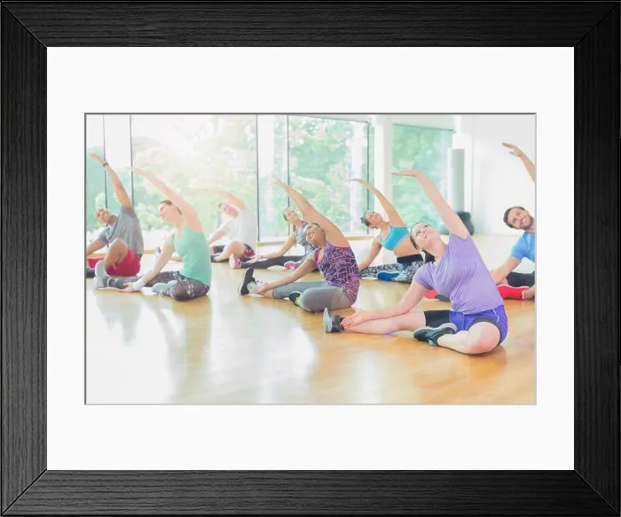 Framed Print : Exercise class stretching arms Framed Print : Exercise class stretching arms