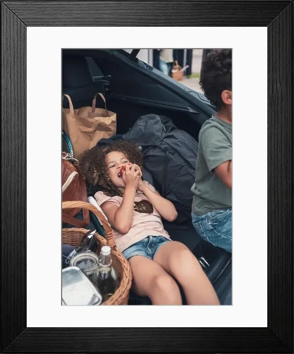 Framed Print : High angle view of girl eating apple by brother in car trunk Framed Print : High angle view of girl eating apple by brother in car trunk