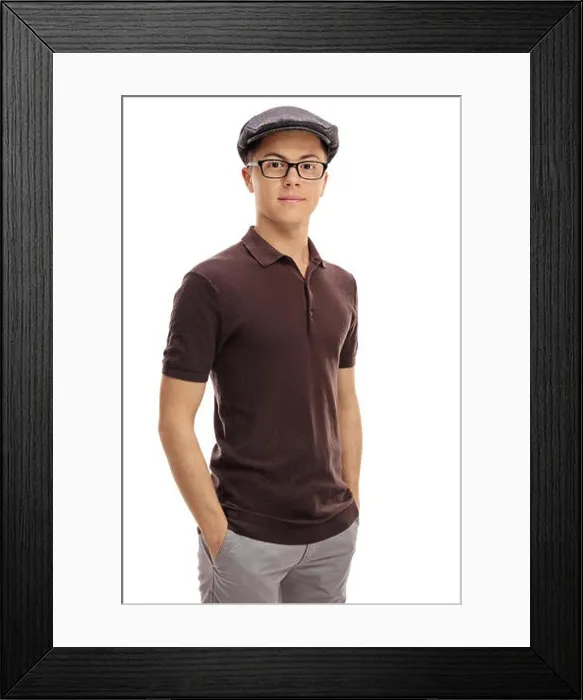 Framed Print : Teenage boy in a retro outfit looking at the camera isolated on white background Framed Print : Teenage boy in a retro outfit looking at the camera isolated on white background