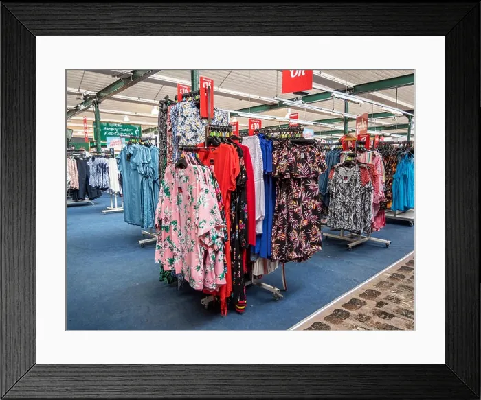 Framed Print : Multi shopping experience in the Ladies clothing department at a retail business park Framed Print : Multi shopping experience in the Ladies clothing department at a retail business park
