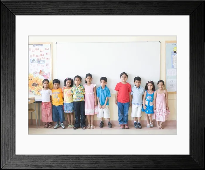 Framed Print : Children standing in front of the whiteboard in a classroom Framed Print : Children standing in front of the whiteboard in a classroom