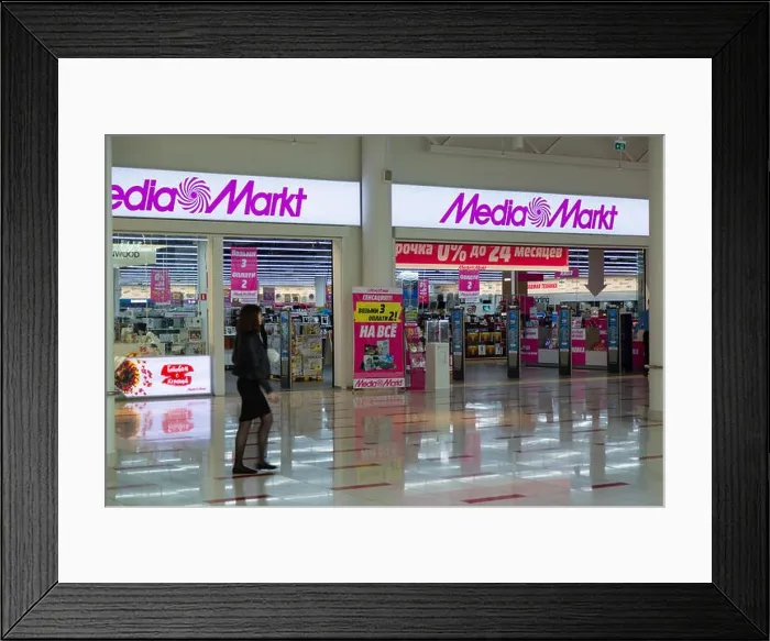 Framed Print : MOSCOW, RUSSIA - MAY 26, 2018: MediaMarkt CE store entrance in the Aviapark shopping mall. The Safmar group agreed to purchase a Russian network of ho