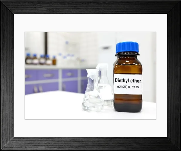 Framed Print : Selective focus of diethyl ether liquid chemical compound in dark glass bottle inside a chemistry laboratory with copy space Framed Print : Selective focus of diethyl ether liquid chemical compound in dark glass bottle inside a chemistry laboratory with copy space