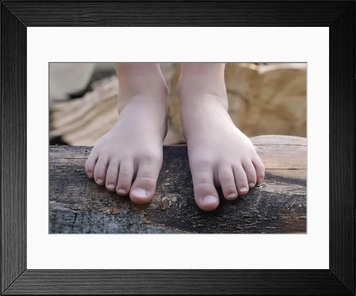 Framed Print : Child feet on wood log, barefoot little girl on tree trunk, countryside lifestyle, concept of grounding and connecting with nature Framed Print : Child feet on wood log, barefoot little girl on tree trunk, countryside lifestyle, concept of grounding and connecting with nature