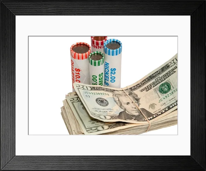 Framed Print : American currency with stacks of bills and rolls of coins standing next to them Framed Print : American currency with stacks of bills and rolls of coins standing next to them