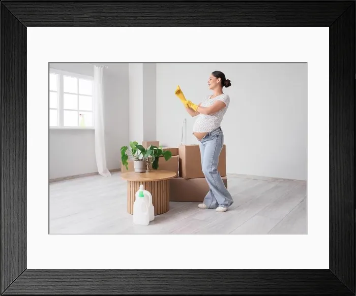 Framed Print : Young pregnant woman with rubber gloves preparing for cleaning in new apartment Framed Print : Young pregnant woman with rubber gloves preparing for cleaning in new apartment