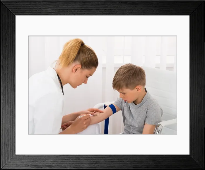 Framed Print : Doctor Taking Blood Sample Of Child Patient Framed Print : Doctor Taking Blood Sample Of Child Patient