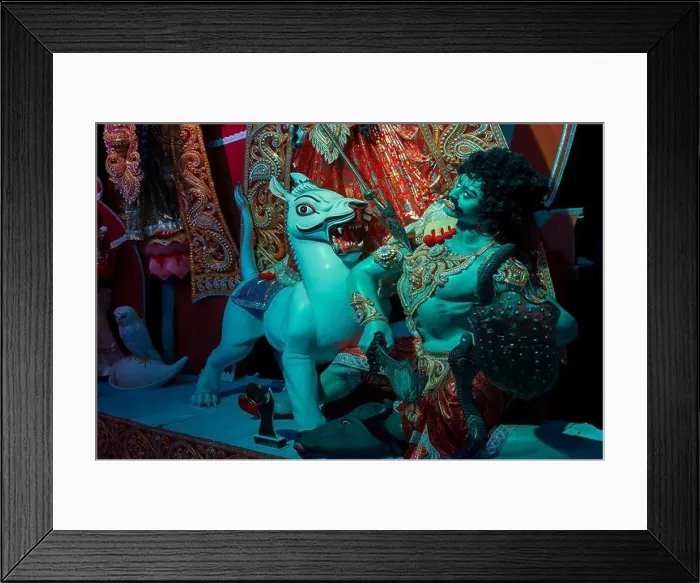 Framed Print : Idol of Lion killing Mahishasura or Asura, at decorated Durga Puja pandal at feet of Durga idol, Durga Puja festival at night. Shot under color light Framed Print : Idol of Lion killing Mahishasura or Asura, at decorated Durga Puja pandal at feet of Durga idol, Durga Puja festival at night. Shot under color light