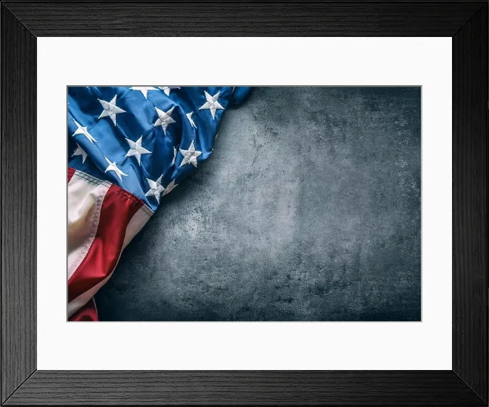 Framed Print : USA flag. American flag. American flag freely lying on concrete background. Close-up Studio shot. Toned Photo