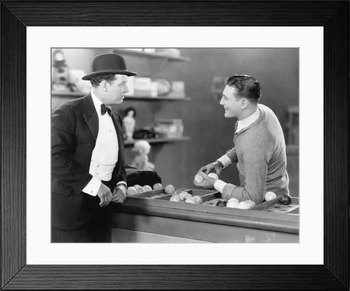 Framed Print : Two men standing together talking Framed Print : Two men standing together talking