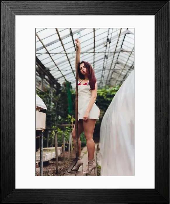 Framed Print : pretty young woman gardening in an apron, without clothes Framed Print : pretty young woman gardening in an apron, without clothes