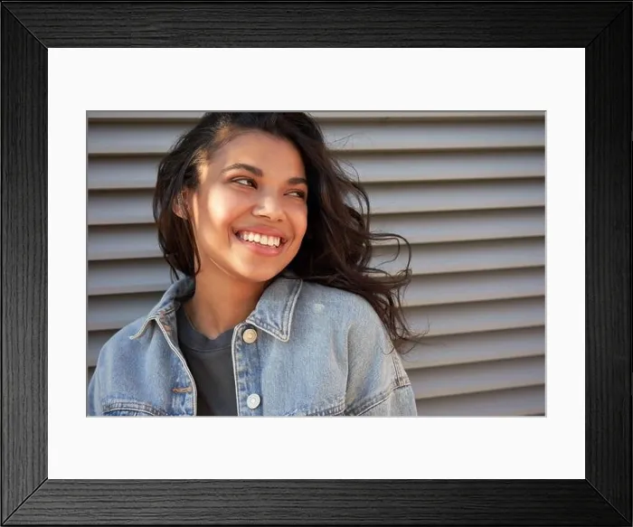 Framed Print : Smiling young African American teen girl looking away laughing, headshot Framed Print : Smiling young African American teen girl looking away laughing, headshot