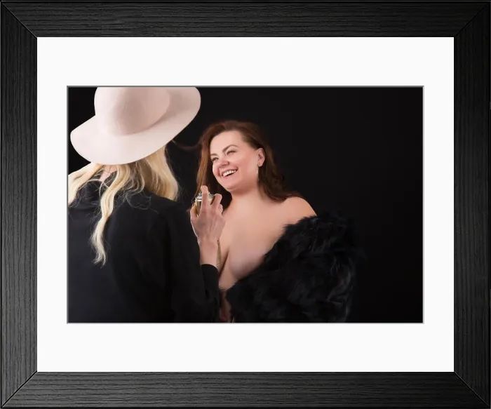 Framed Print : Model plus size with lush chest, happy smiling girl. visagiste doing makeup or hairstyle for XXL model in black artificial fur coat. XXL female on bla Framed Print : Model plus size with lush chest, happy smiling girl. visagiste doing makeup or hairstyle for XXL model in black artificial fur coat. XXL female on bla