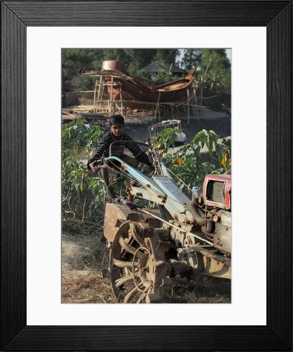 Framed Print : boy on an old tractor in South Bangladesh Asia Framed Print : boy on an old tractor in South Bangladesh Asia