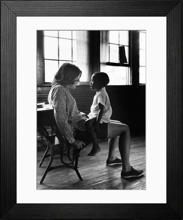 Framed Print : Volunteer for Family of Children, an early 1960s program predating Volunteers in Service to America (VISTA), with a young child in North Carolina Framed Print : Volunteer for Family of Children, an early 1960s program predating Volunteers in Service to America (VISTA), with a young child in North Carolina