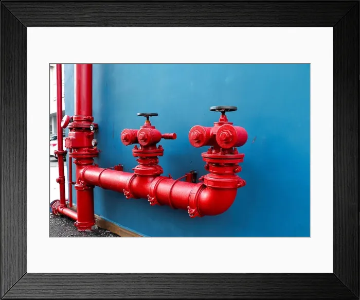 Framed Print : Industrial and building fire extinguishing system, red water pipe on blue background Framed Print : Industrial and building fire extinguishing system, red water pipe on blue background