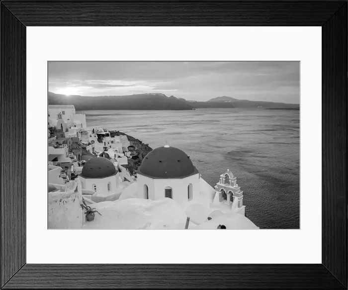 Framed Print : Oia town cityscape at Santorini island in Greece at sunset. Aegean sea in black and white Framed Print : Oia town cityscape at Santorini island in Greece at sunset. Aegean sea in black and white