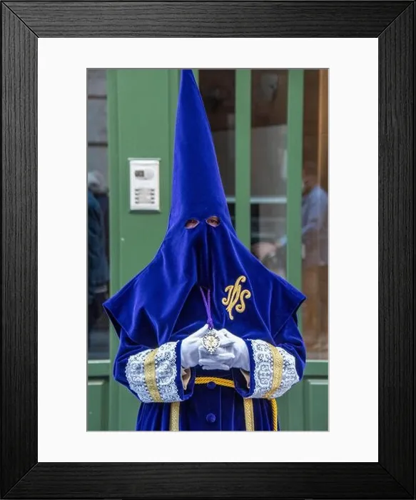 Framed Print : A member of the Cofradía Penitencial de Ntro. Padre Jesús Nazareno during a Semana Santa procession in Valladolid, Spain Framed Print : A member of the Cofradía Penitencial de Ntro. Padre Jesús Nazareno during a Semana Santa procession in Valladolid, Spain