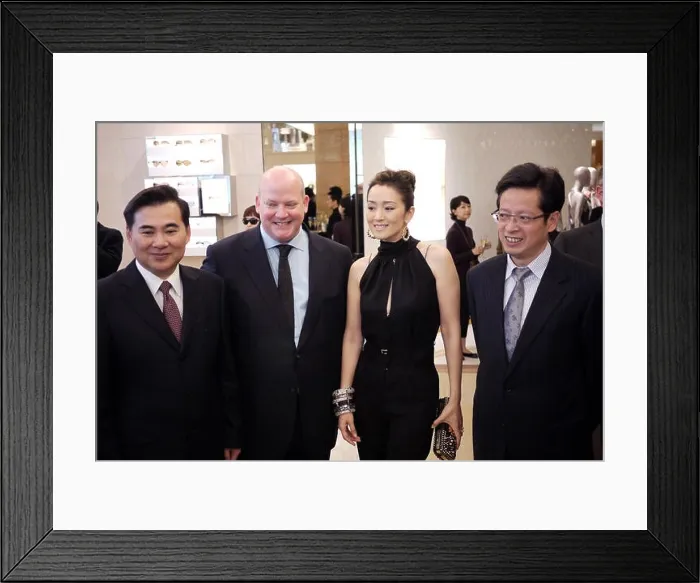 Framed Print : Christopher Zanardi-landi (L2), Louis Vuitton China CEO, and Chinese actress Gong Li visit the newly-opened Louis Vuitton flagship store in Shanghai