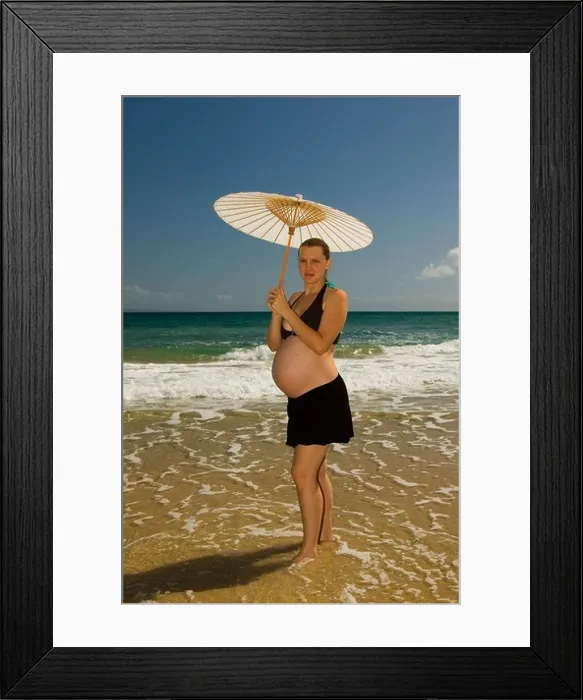 Framed Print : pregnant woman on beach with umbrella Framed Print : pregnant woman on beach with umbrella