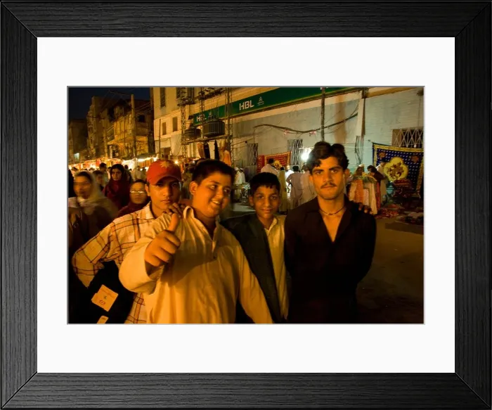 Framed Print : A group of boys at night in the old bazaar in Rawalpindi Pakistan