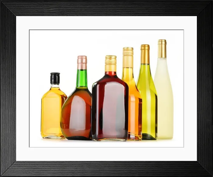 Framed Print : Bottles of assorted alcoholic beverages isolated on white background Framed Print : Bottles of assorted alcoholic beverages isolated on white background