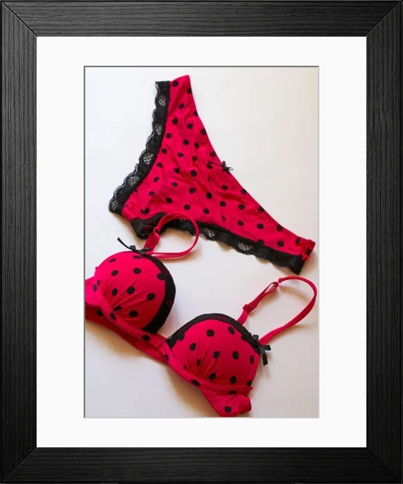 Framed Print : matching sexy polka dot pink coloured with black lace edged underwear set - bra and knickers set on white background Framed Print : matching sexy polka dot pink coloured with black lace edged underwear set - bra and knickers set on white background