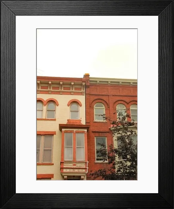Framed Print : beige white and red row house buildings Framed Print : beige white and red row house buildings