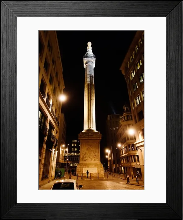 Framed Print : Looking up at the Great Fire of London Monument lit up at night Framed Print : Looking up at the Great Fire of London Monument lit up at night