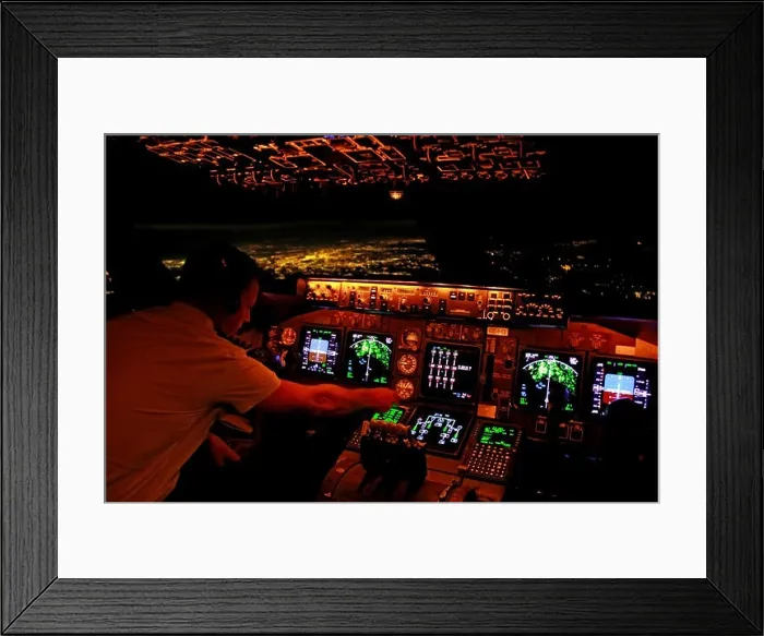 Framed Print : A pilot preparing the FMS on the flight deck of a Boeing 747-400 overhead NYC (in the background) for a landing at Atlanta Hartsfield-Jackson Framed Print : A pilot preparing the FMS on the flight deck of a Boeing 747-400 overhead NYC (in the background) for a landing at Atlanta Hartsfield-Jackson
