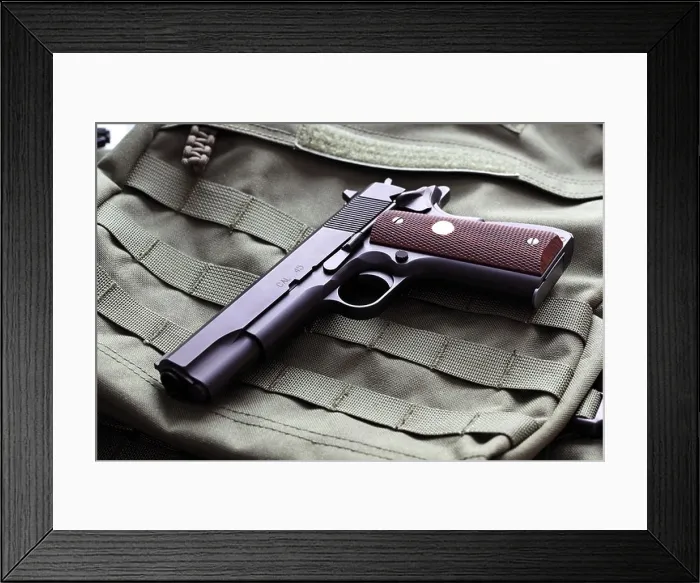 Framed Print : Semi-automatic Colt Mark IV Series 80.45 caliber pistol Framed Print : Semi-automatic Colt Mark IV Series 80.45 caliber pistol