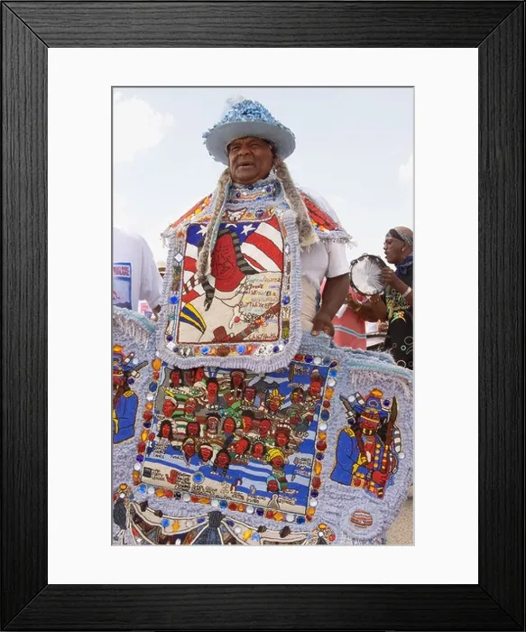Framed Print : Big Chief of a Mardi Gras Indian tribe, displays his tribe's ancestry, beaded in intricate detail, on the front of his costume Framed Print : Big Chief of a Mardi Gras Indian tribe, displays his tribe's ancestry, beaded in intricate detail, on the front of his costume