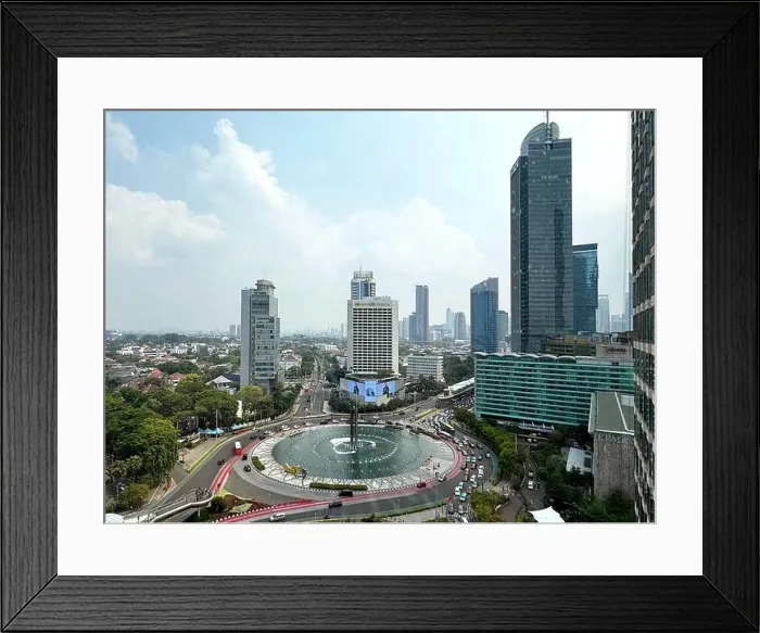 Framed Print : View of Jakarta city centre, the central business district and the famous Bundaran HI roundabout with Jakarta skyscrapers under the sunny blue sky Framed Print : View of Jakarta city centre, the central business district and the famous Bundaran HI roundabout with Jakarta skyscrapers under the sunny blue sky
