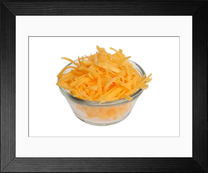 Framed Print : Grated cheddar cheese in bowl on white background Framed Print : Grated cheddar cheese in bowl on white background