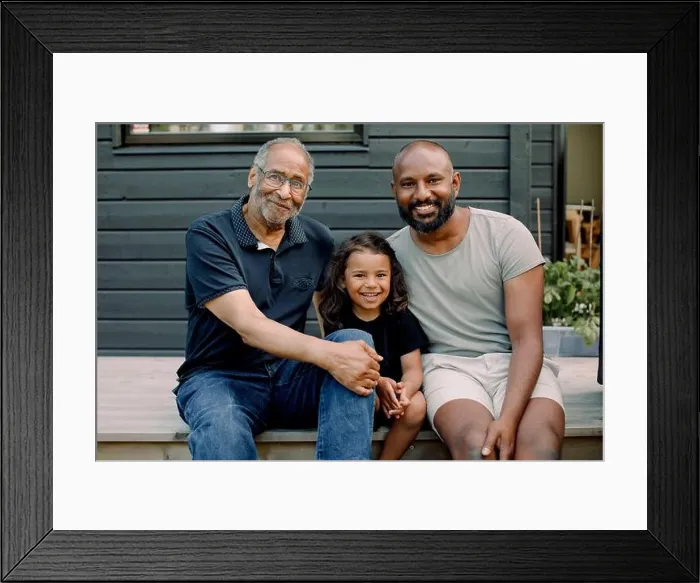 Framed Print : Portrait of smiling boy sitting with father and grandfather on porch Framed Print : Portrait of smiling boy sitting with father and grandfather on porch