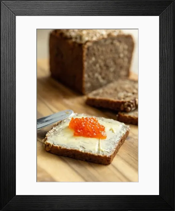 Framed Print : a sandwich of black bread, butter and red salmon caviar Framed Print : a sandwich of black bread, butter and red salmon caviar