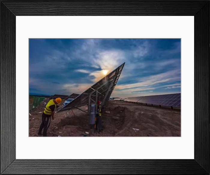Framed Print : XINJIANG, CHINA - SEPTEMBER 30, 2024 - A worker checks a photovoltaic panel in Xinjiang, China, September 30, 2024 Framed Print : XINJIANG, CHINA - SEPTEMBER 30, 2024 - A worker checks a photovoltaic panel in Xinjiang, China, September 30, 2024