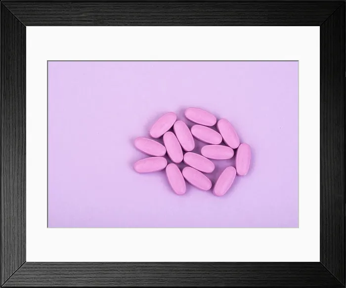 Framed Print : Colored medical capsules on bright background Framed Print : Colored medical capsules on bright background