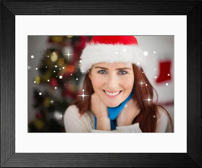 Framed Print : Composite image of festive redhead smiling at camera Framed Print : Composite image of festive redhead smiling at camera