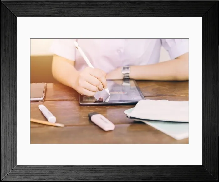 Framed Print : School student using touchscreen tablet computer device to learning and writing homework, modern technology for education Framed Print : School student using touchscreen tablet computer device to learning and writing homework, modern technology for education