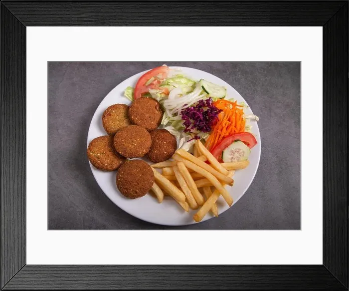 Framed Print : Falafel plate with salad and french fries isolated on rustic background Framed Print : Falafel plate with salad and french fries isolated on rustic background