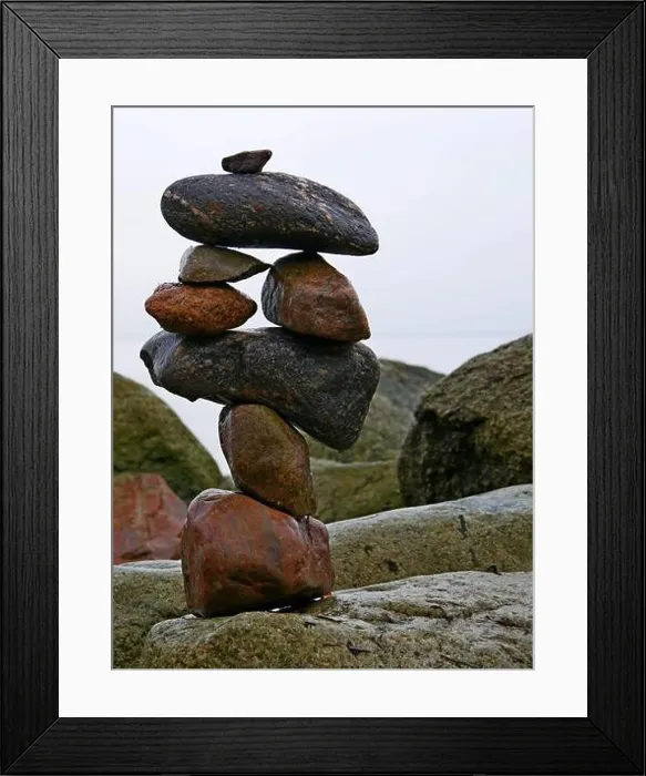 Framed Print : the art of balancing stones, stacked on a big stone on the beach Framed Print : the art of balancing stones, stacked on a big stone on the beach
