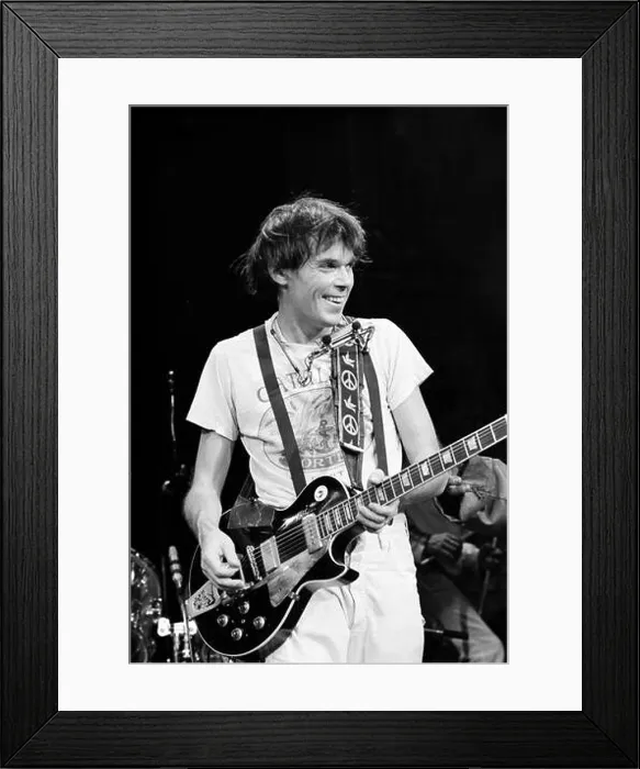 Framed Print : Musician Neil Young plays guitar during the Rust Never Sleeps tour in Madison, Wisconsin in 1978 Framed Print : Musician Neil Young plays guitar during the Rust Never Sleeps tour in Madison, Wisconsin in 1978